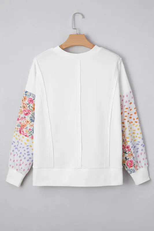 Plus Size Exposed Seam Detail Contrast Dot Floral Patchwork Sleeve Sweatshirt sold by Beagle Boutique