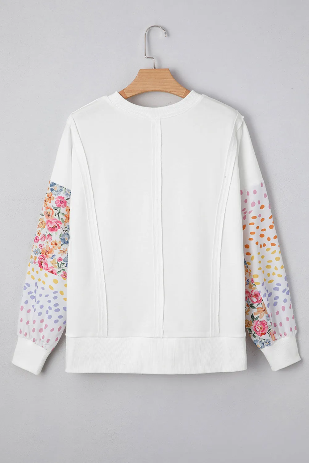 Plus Size Exposed Seam Detail Contrast Dot Floral Patchwork Sleeve Sweatshirt sold by Beagle Boutique