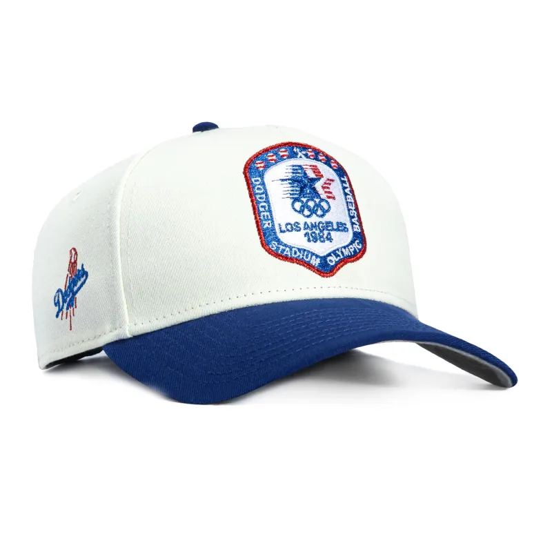 New Era 9Forty A-Frame Los Angeles Dodgers Logo Patch 1984 Olympic Stadium Snapback Hat - White, Royal sold by Hat Club