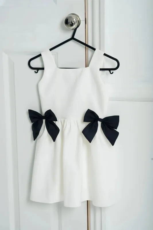 Mini White Bow Dress sold by Anne Louise Boutique