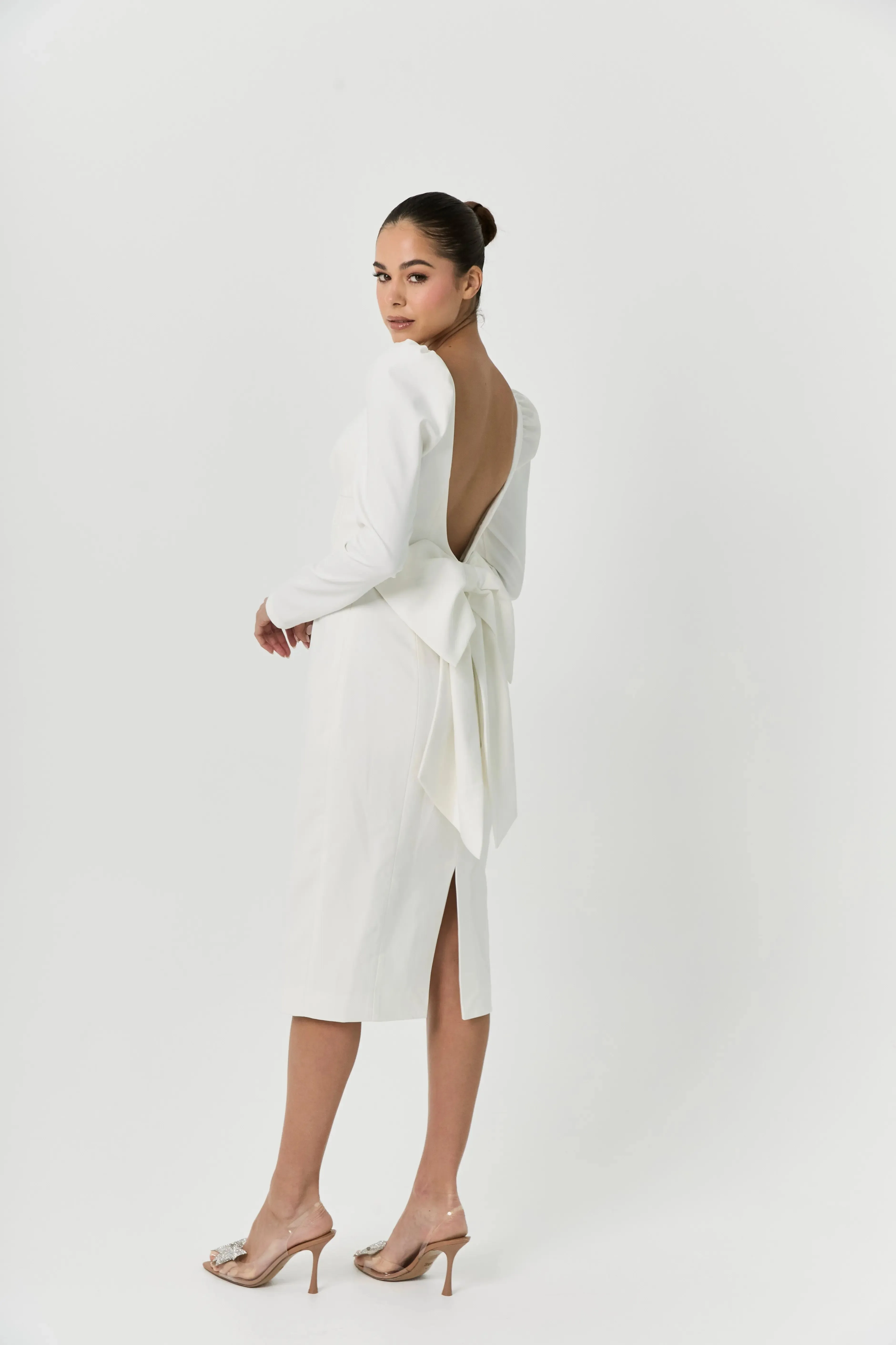 White midi bow dress sold by Anne Louise Boutique