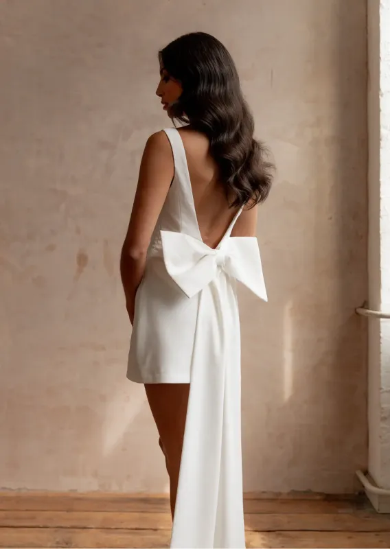 White Dove Bow Dress sold by Anne Louise Boutique