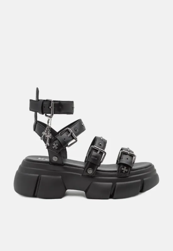 A Raining Vengeance Charm Platform Sandals sold by Damaged Society