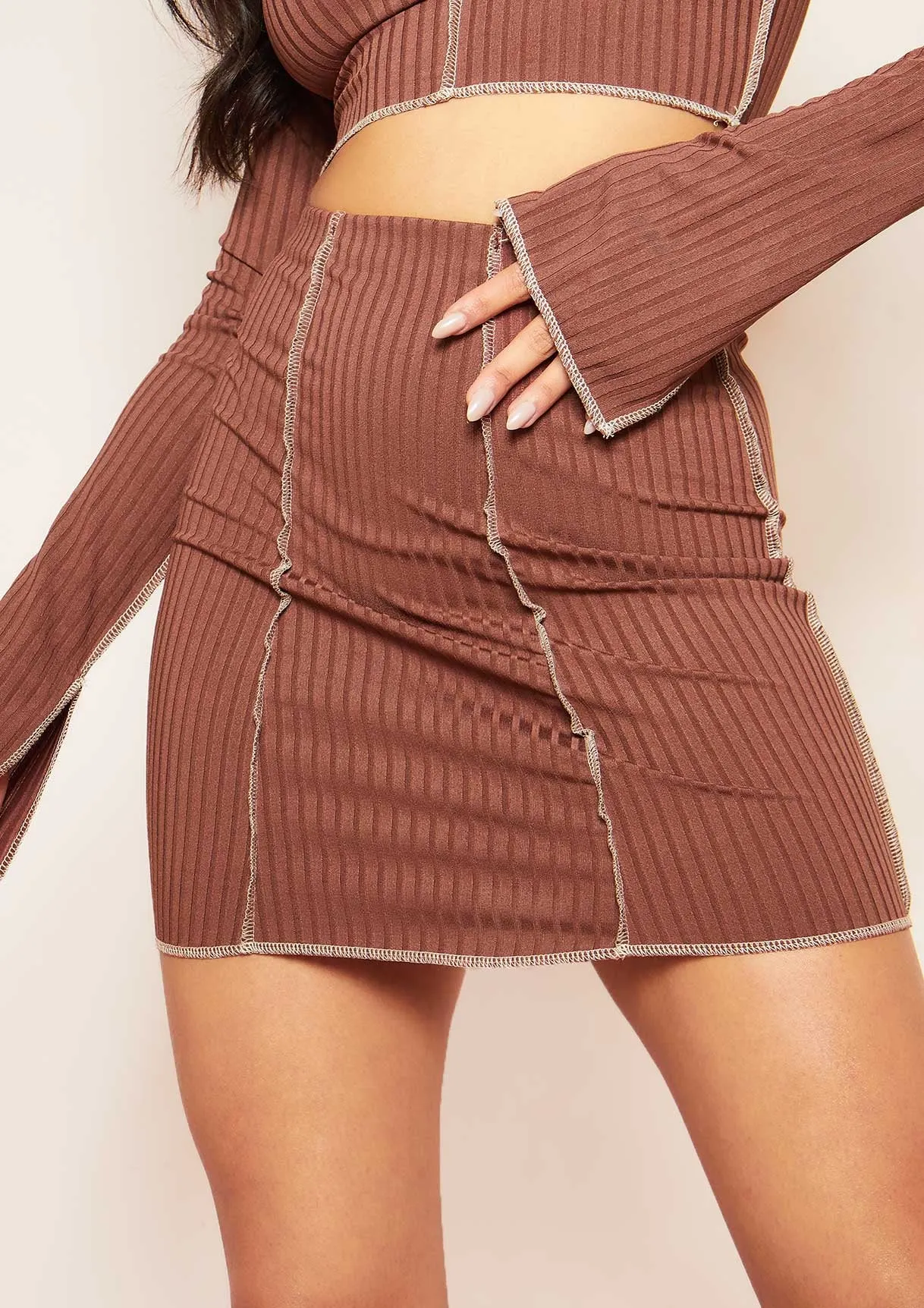 Louana Chocolate Contrast Stitch Ribbed Mini Skirt sold by Missy Empire