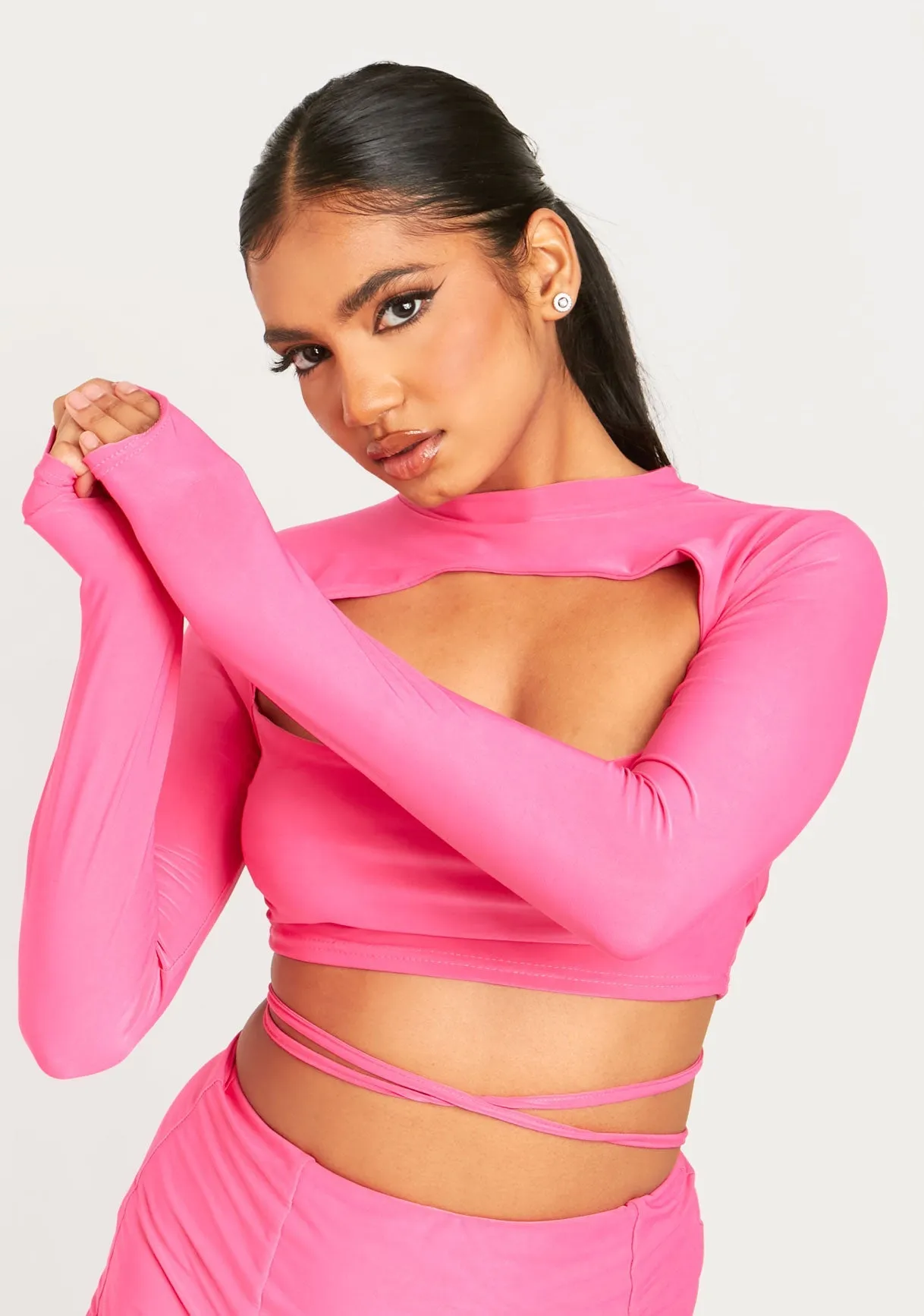 Izzie Pink Cut Out Lace Up Long Sleeve Crop Top sold by Missy Empire