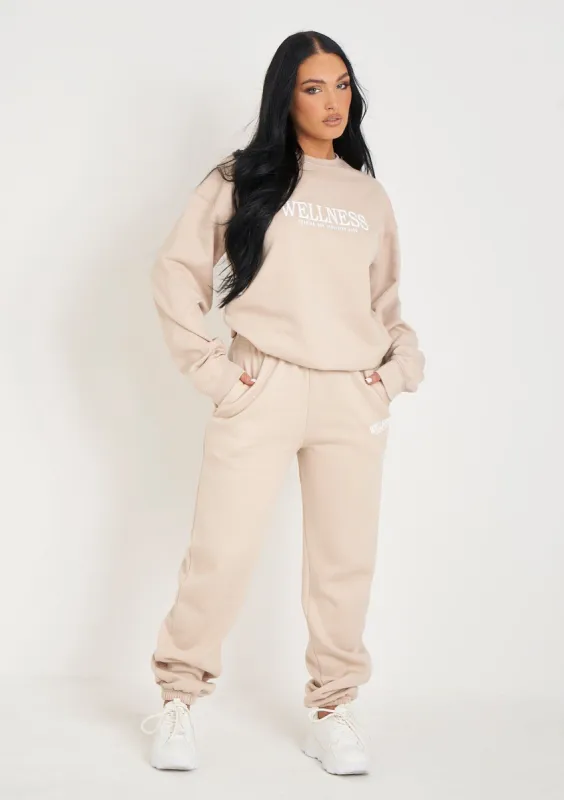 Jolie Beige Wellness Embroidered Cuffed Joggers sold by Missy Empire