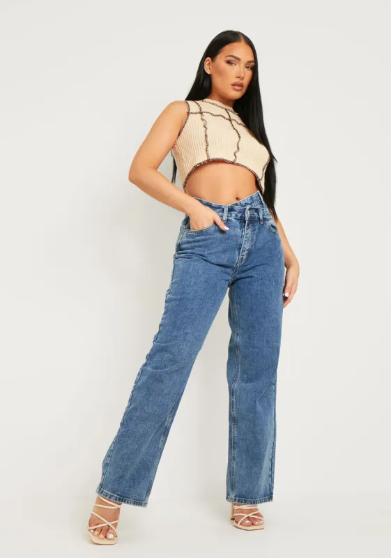 Elise Mid Wash Waist Button Detail Loose Fit Straight Leg Jeans sold by Missy Empire