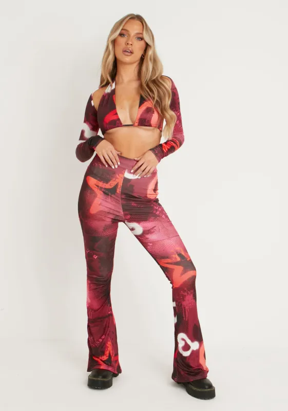 Odette Graffiti Print Flared Trousers sold by Missy Empire
