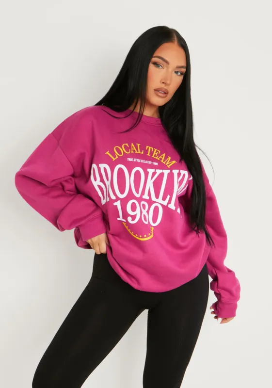 Genevieve Pink Brooklyn Graphic Sweatshirt sold by Missy Empire