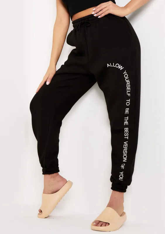 Liya Black Slogan Oversized Joggers sold by Missy Empire