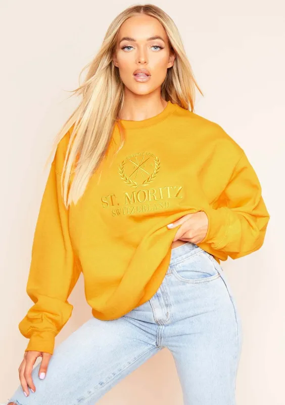 Halyn Bright Gold St. Moritz Slogan Oversized Sweatshirt sold by Missy Empire