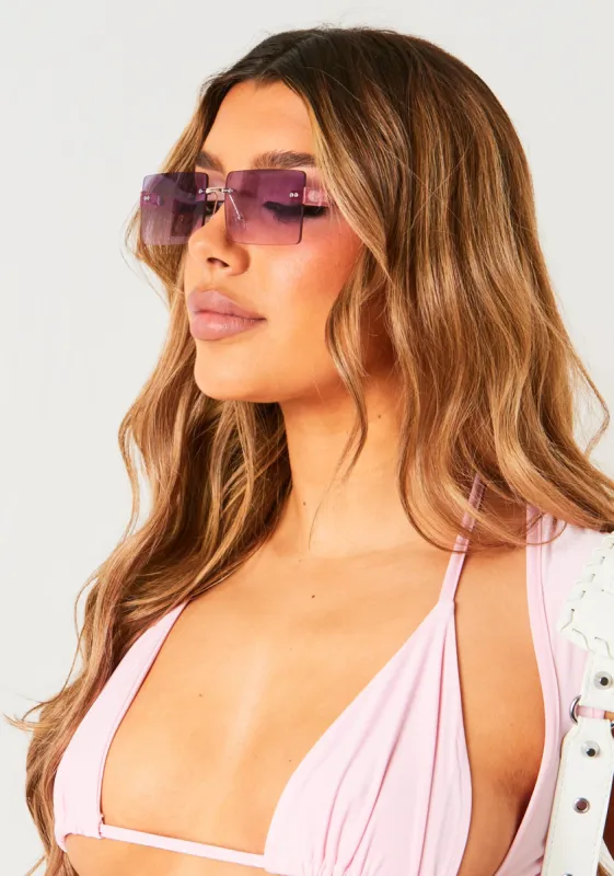 Bella Pink Lense Frameless Sunglasses sold by Missy Empire