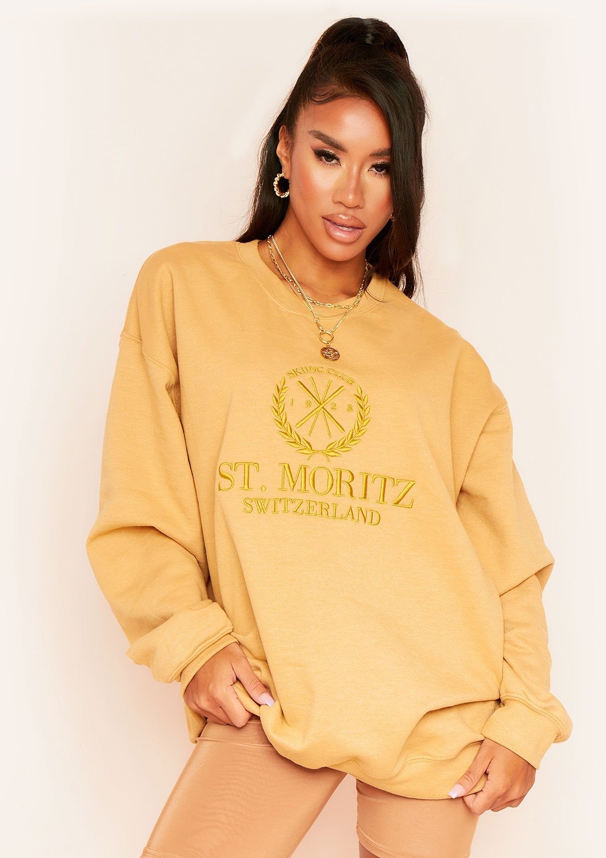Halyn Gold St. Moritz Slogan Oversized Sweatshirt sold by Missy Empire