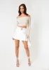 Rochelle White Faux Leather Belted Mini Skirt sold by Missy Empire