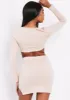 Mina Beige Tie Up Cut Out Long Sleeve Crop Top sold by Missy Empire