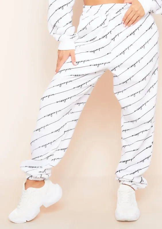 Eliora White Missy Empire Repetitive Slogan Joggers sold by Missy Empire