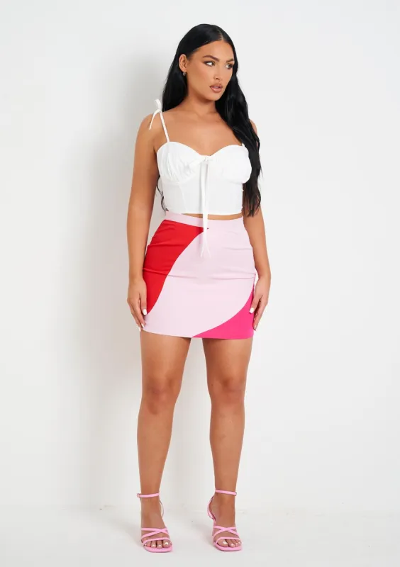 Addilyn Pink And Red Colour Block Mini Skirt sold by Missy Empire