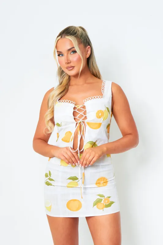 Erin Lemon Print Lace Up Front Sleeveless Top sold by Missy Empire