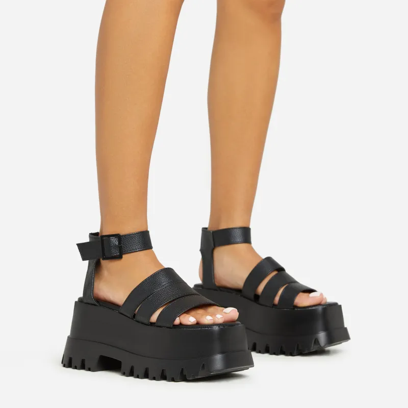 Track Multi Strap Detail Chunky Platform Sole Flat Sandal In Black Faux Leather sold by Missy Empire