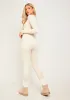Eli Cream Plunge Ribbed Seamless Long Sleeve Jumpsuit sold by Missy Empire