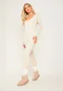 Eli Cream Plunge Ribbed Seamless Long Sleeve Jumpsuit sold by Missy Empire