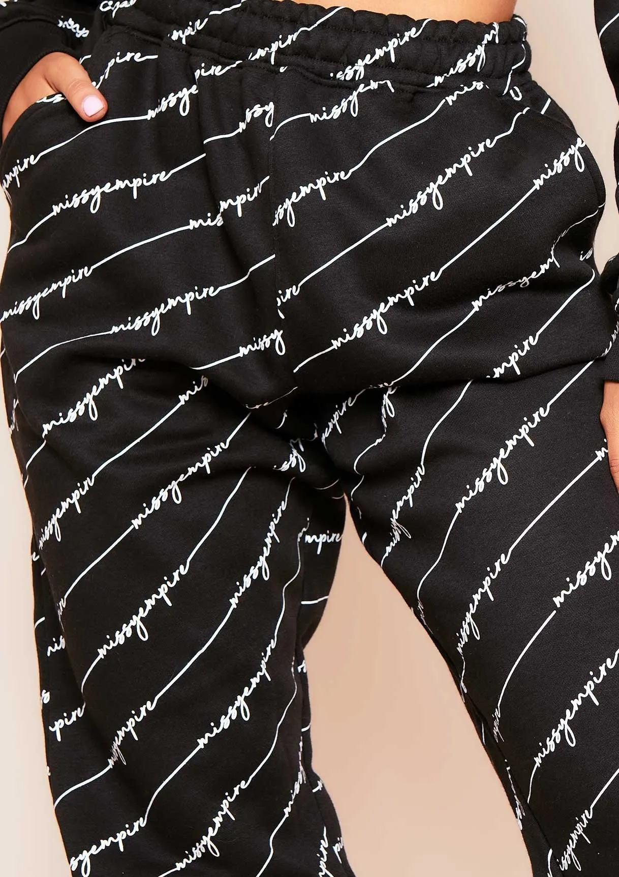 Eliora Black Missy Empire Repetitive Slogan Joggers sold by Missy Empire product image thumbnail 2