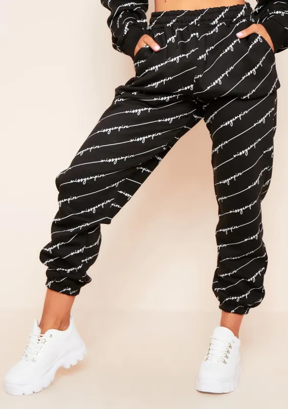 Eliora Black Missy Empire Repetitive Slogan Joggers sold by Missy Empire