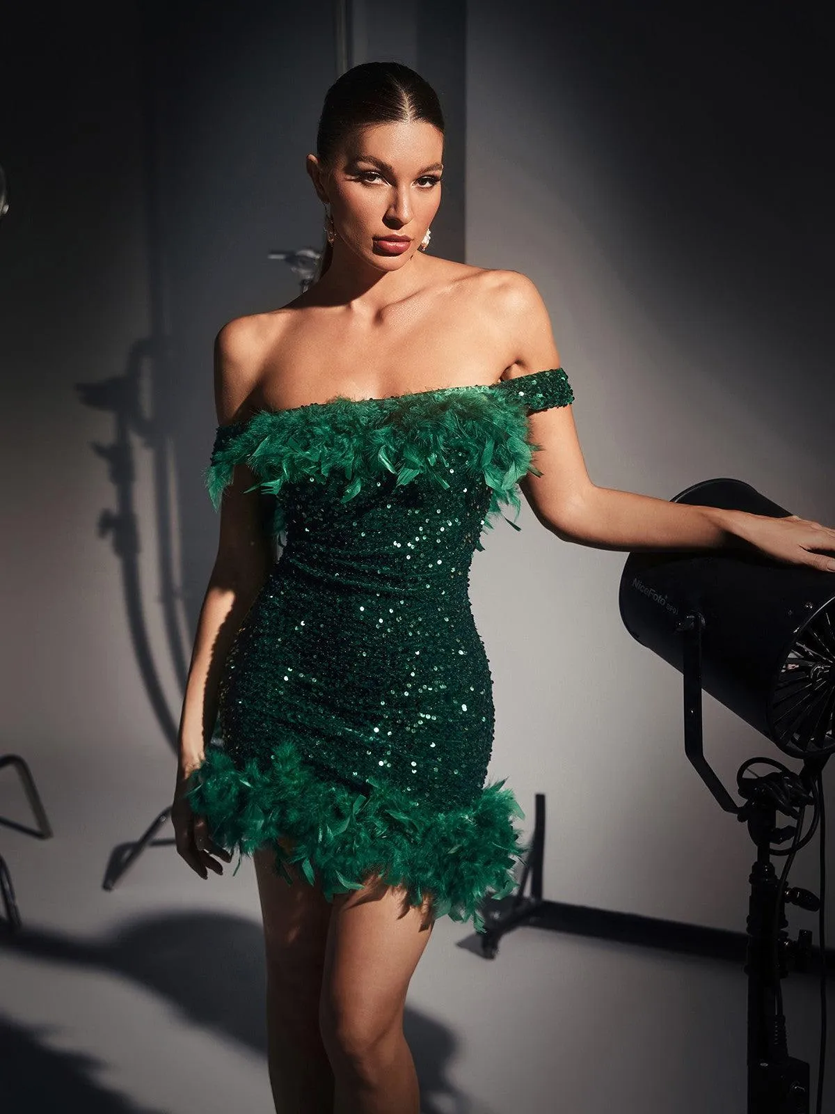 Amaris Off Shoulder Sequin Feather Mini Dress In Green sold by Mew Mews