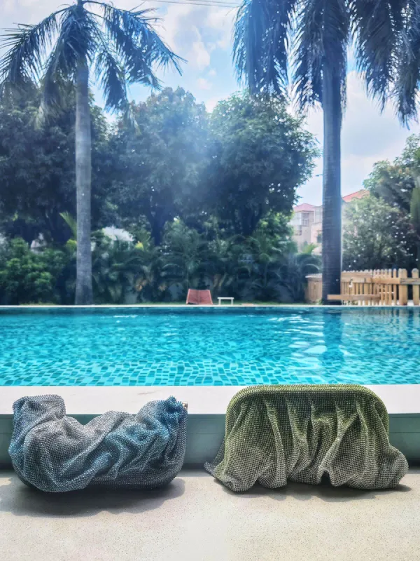 Marigold Ruched Crystal Clutch In Yellow sold by Mew Mews