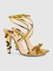 Juliette Metallic Snake Heel Sandals In Gold sold by Mew Mews