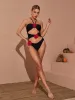 Addy Halterneck Cutout Embellished Swimsuit In Black sold by Mew Mews