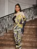Choncey Rhinestone Printed Jumpsuit sold by Mew Mews