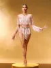 Axiom Long Sleeve Fringe Bodysuit In Nude sold by Mew Mews