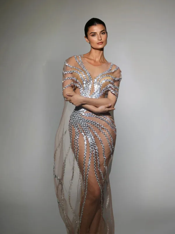 Saelyra Shawl Sequin Mesh Maxi Dress In Silver sold by Mew Mews