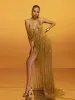 Elvrik Halterneck Fringe Cutout Split Maxi Dress In Gold sold by Mew Mews