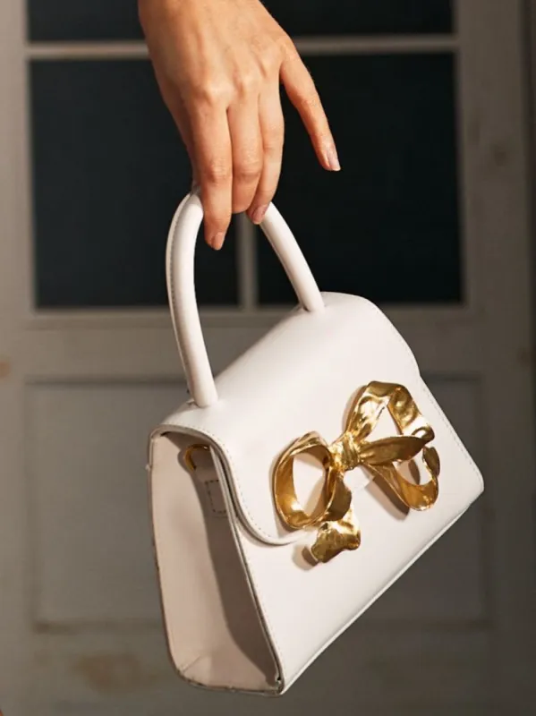 Lasma Metallic Bow White Clutch made by Mew Mews