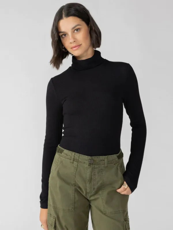 Essential Turtleneck Top | Black sold by Belletique