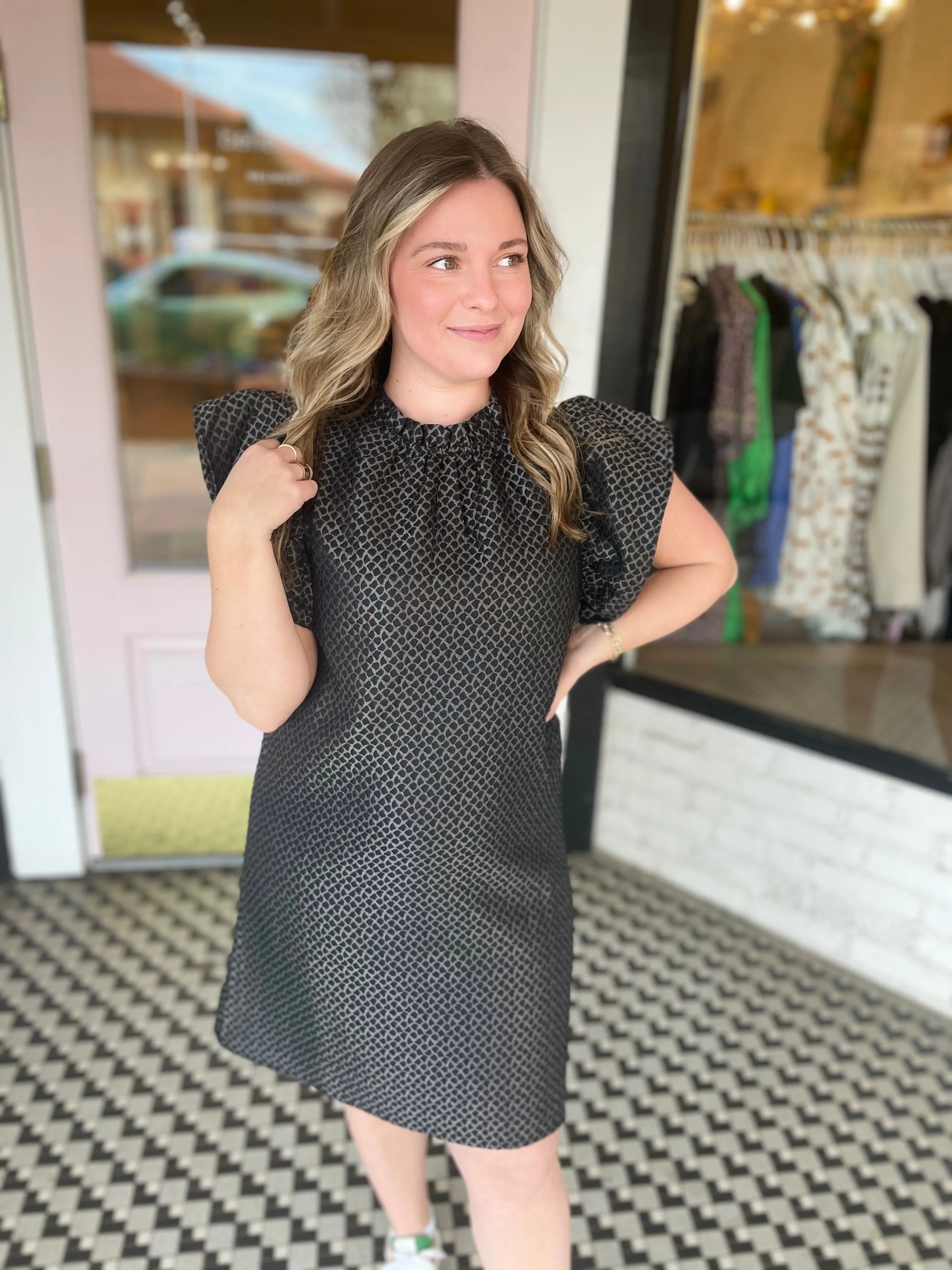 Black Flutter Dress sold by Belletique