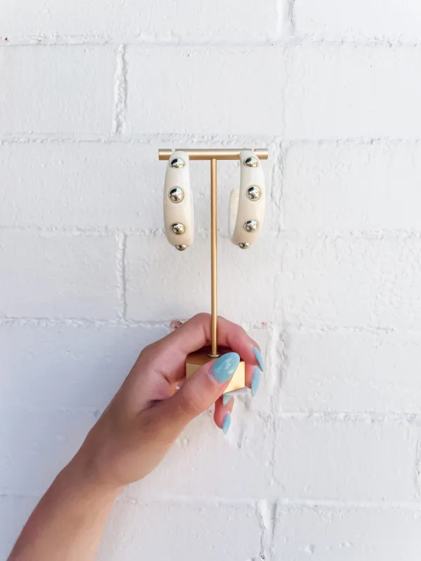 Ivory Acrylic Hoop with Gold Studs sold by Belletique