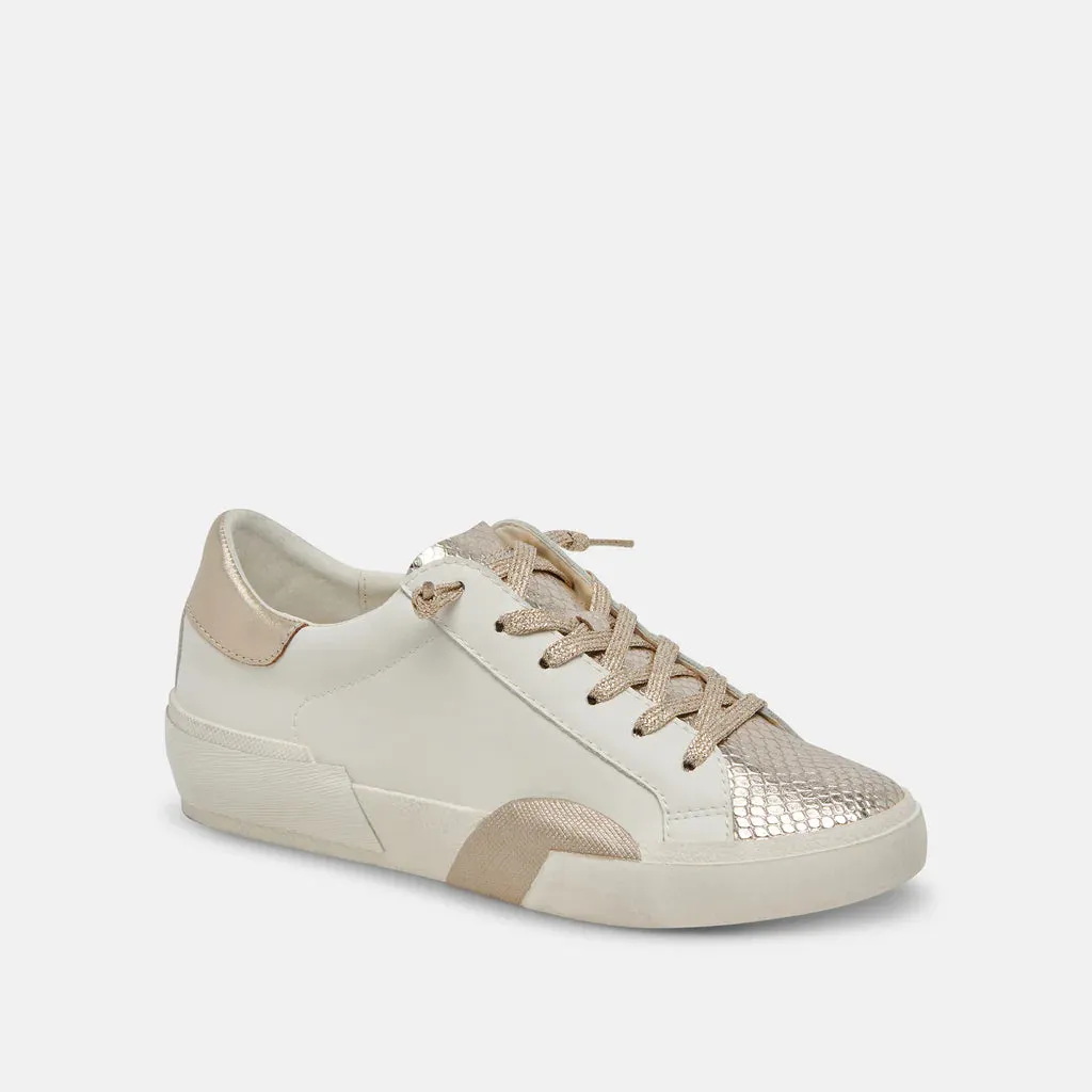 Zina Sneakers | Gold/White sold by Belletique
