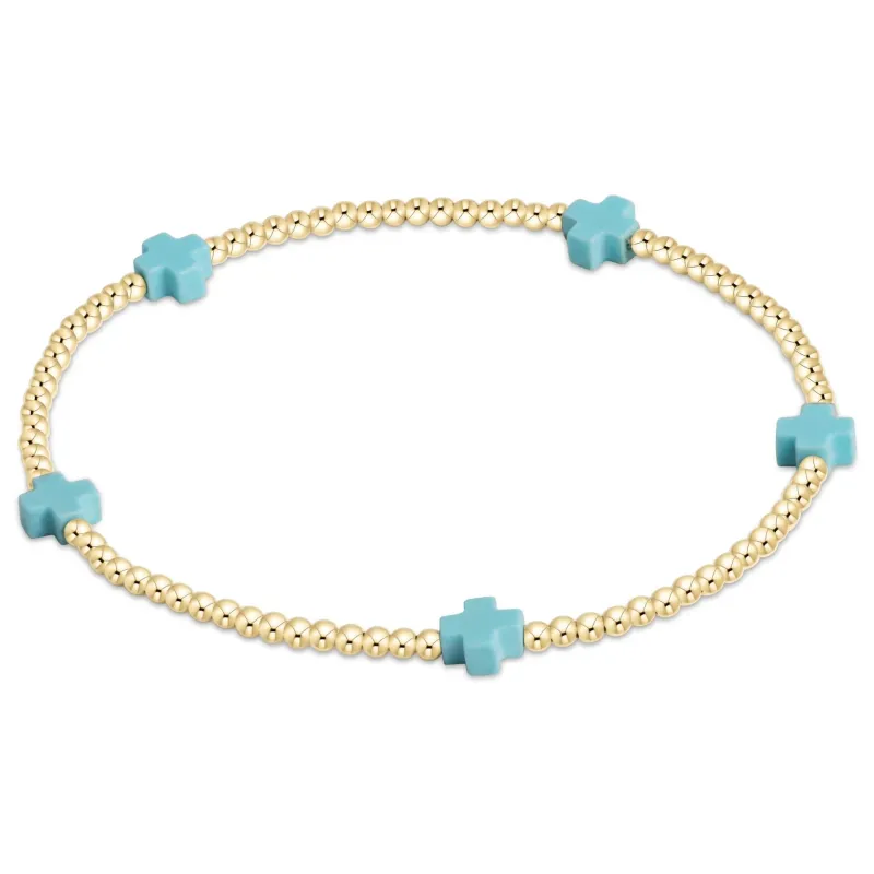 turquoise - 2mm signature small cross gold pattern bead bracelet sold by Belletique