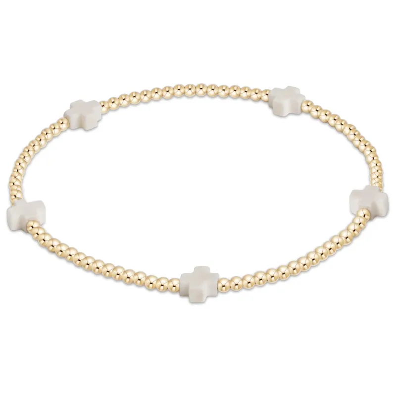 off-white - 2mm signature small cross gold pattern bead bracelet sold by Belletique