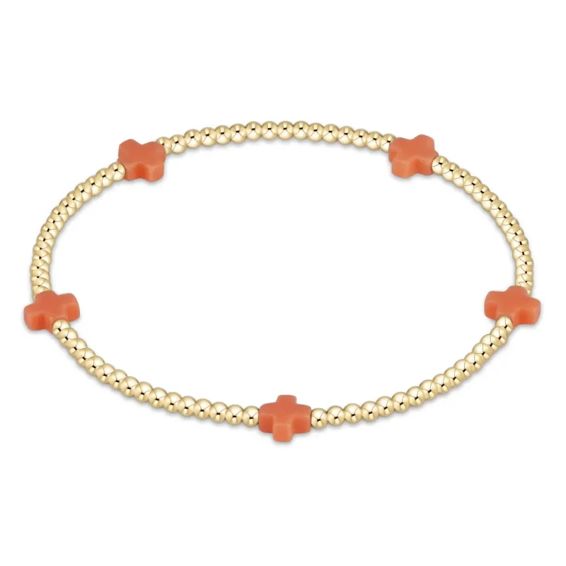coral - 2mm signature small cross gold pattern bead bracelet sold by Belletique
