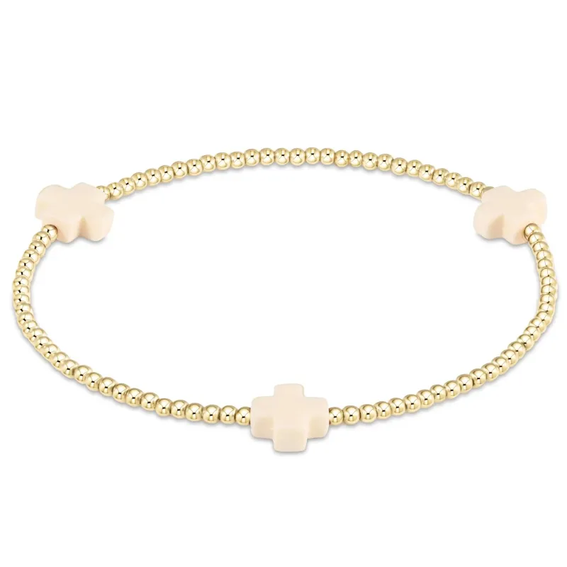 signature cross gold pattern 2mm bead bracelet - off-white sold by Belletique