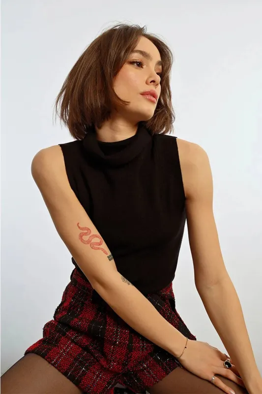 Sleeveless Turtleneck Sweater | Black sold by Belletique