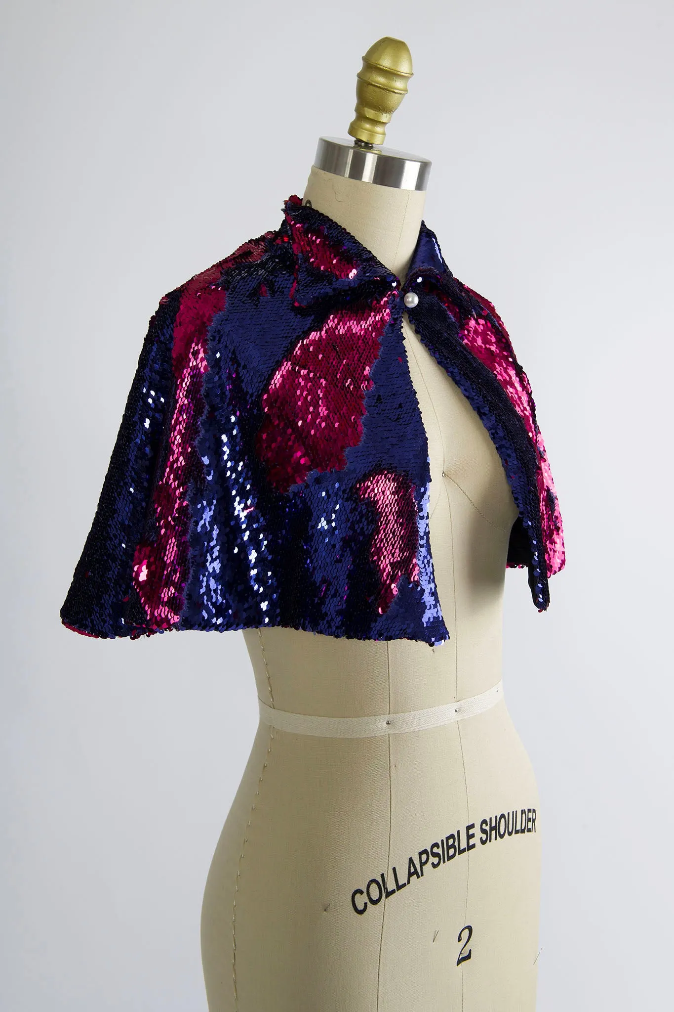 Synergy Cape in Fuchsia and Purple Sequin sold by Batsheva
