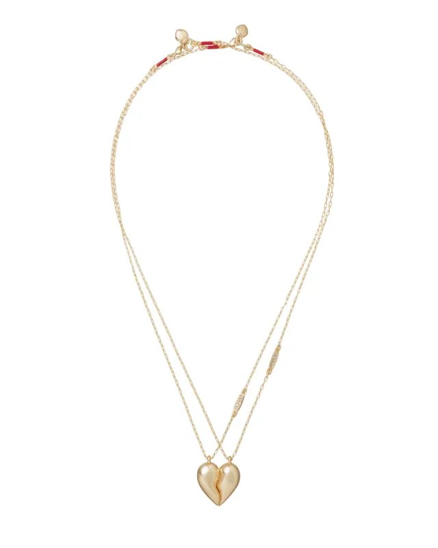 The You and Me Heart Pendant Duo sold by Roxanne Assoulin