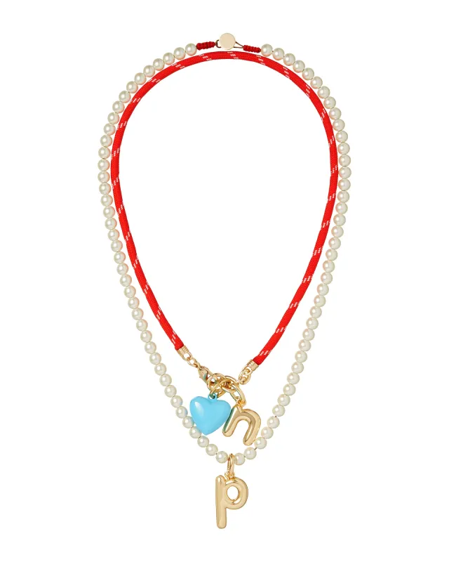 The Happy Cord Charm Necklace Duo sold by Roxanne Assoulin