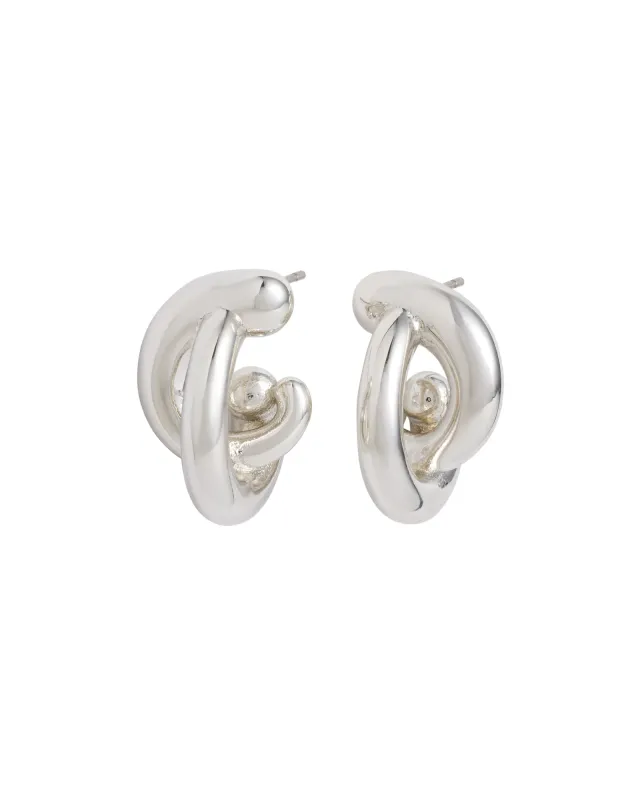 The Twist Earrings in Silver sold by Roxanne Assoulin
