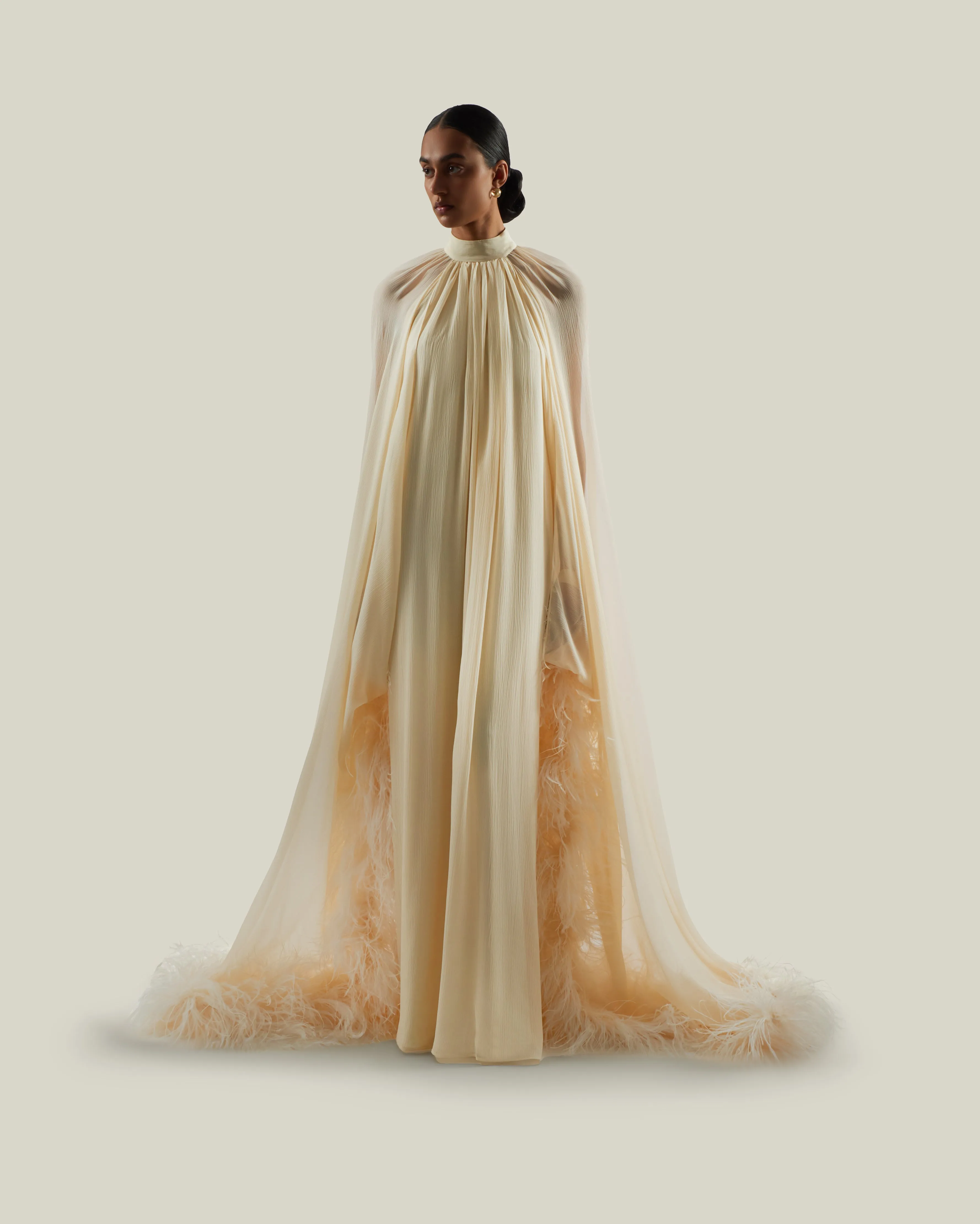 Feathered Eterea Gown in Ivory sold by Taller Marmo
